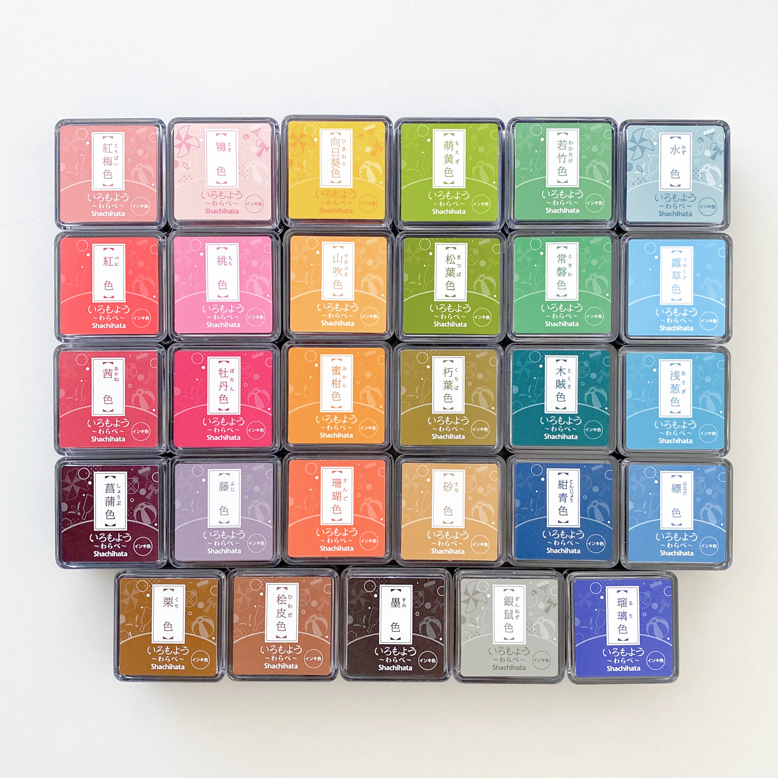 A grid of Shachihata color stamp pads in assorted Japanese ink shades, from the Ink collection