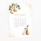 September 2025 calendar card with a pear branch and a halved pear on a white background