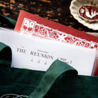 The Reunion journal in its card-pocket cover, tucked into a green tote. Photo: OURS Studio