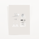Soft gray journaling card with a white lace bralette, a perfume bottle with ribbon, mascara, rings, and a blossom sprig